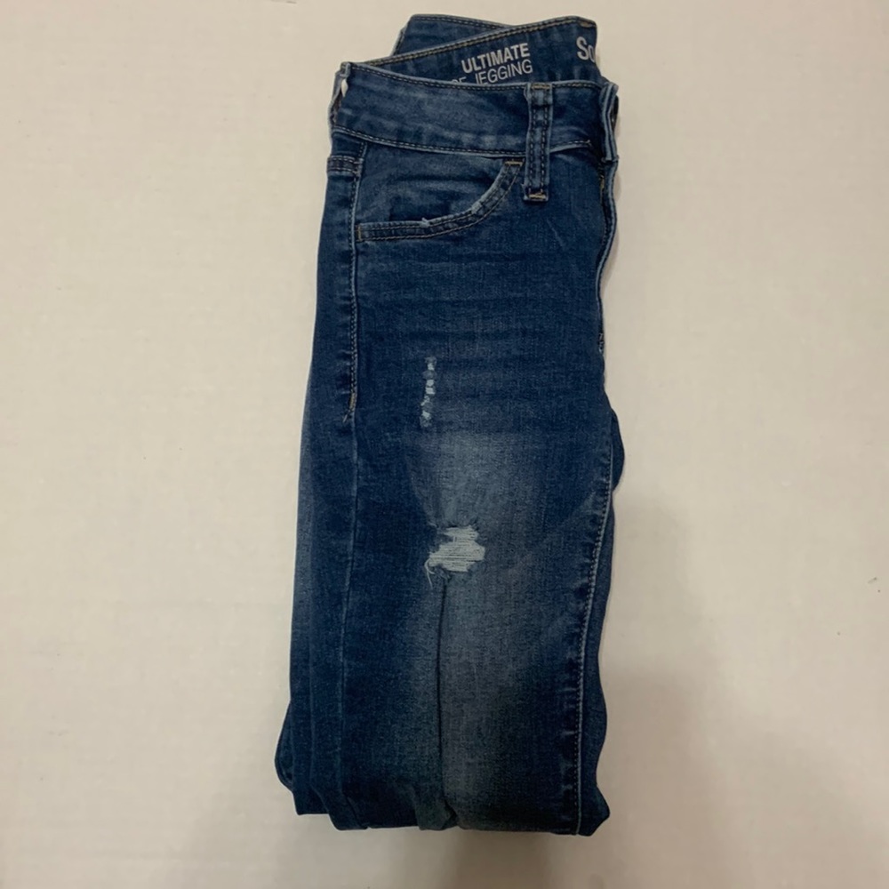 Dark wash Ultimate low rise jeggings! With distressed rips